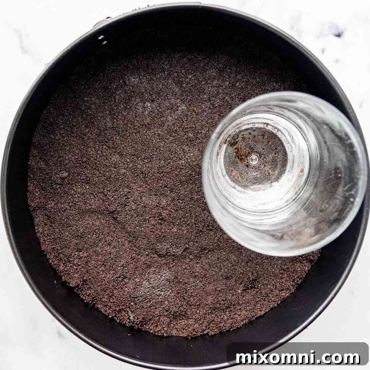 oreos pressed into a cheesecake pan