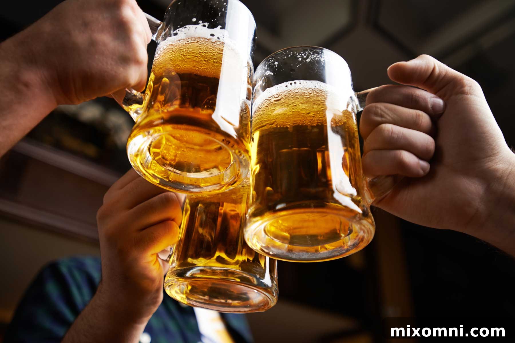 three beer mugs clinking.