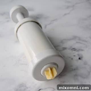 churro dough in a pastry filler