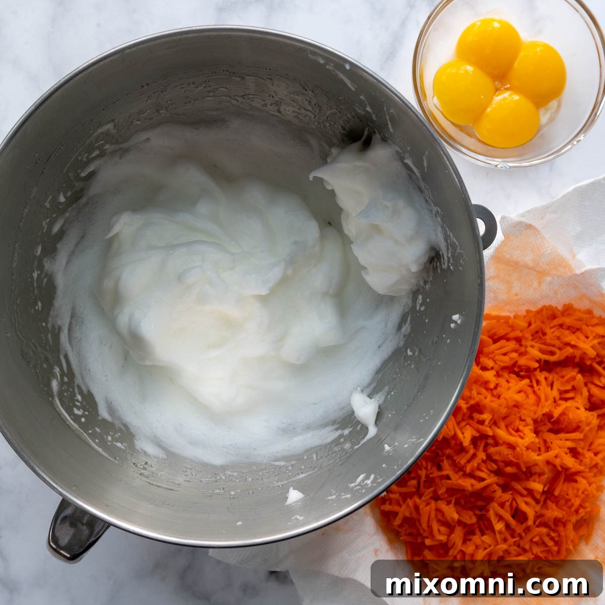 grated carrots, egg whites, and egg yolks.