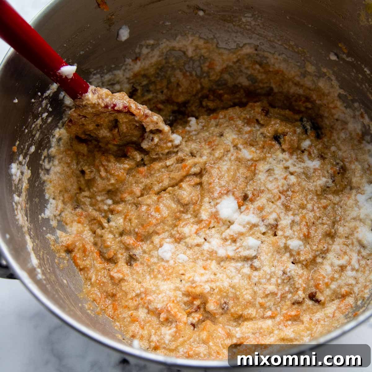 a spoon folding in the egg whites.