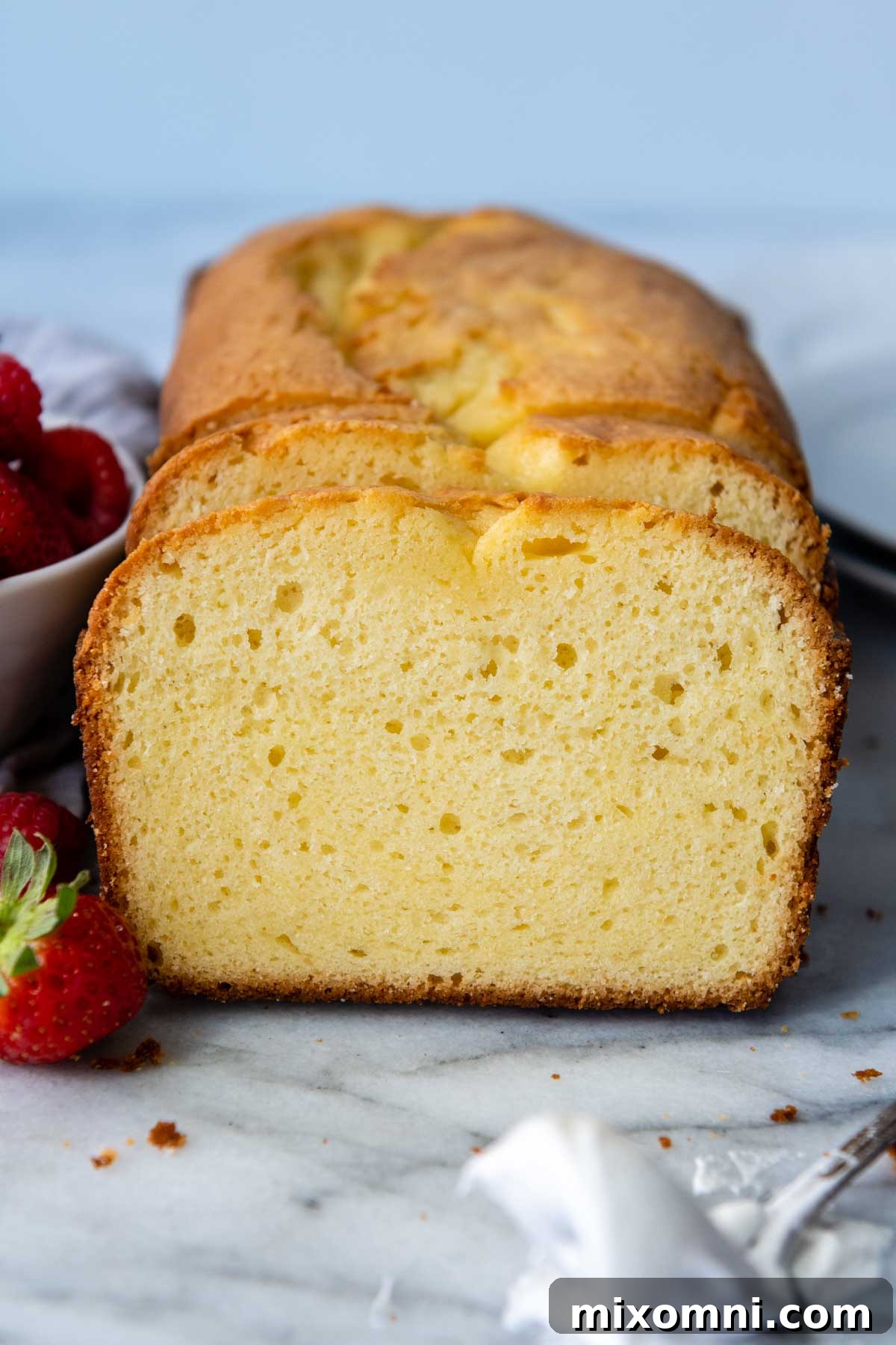 Slices of perfectly baked gluten-free pound cake, showcasing its moist and tender crumb.