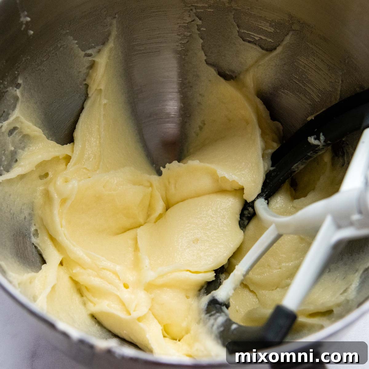 The creamy mixture of butter, cream cheese, and sugar after being beaten until pale and fluffy.