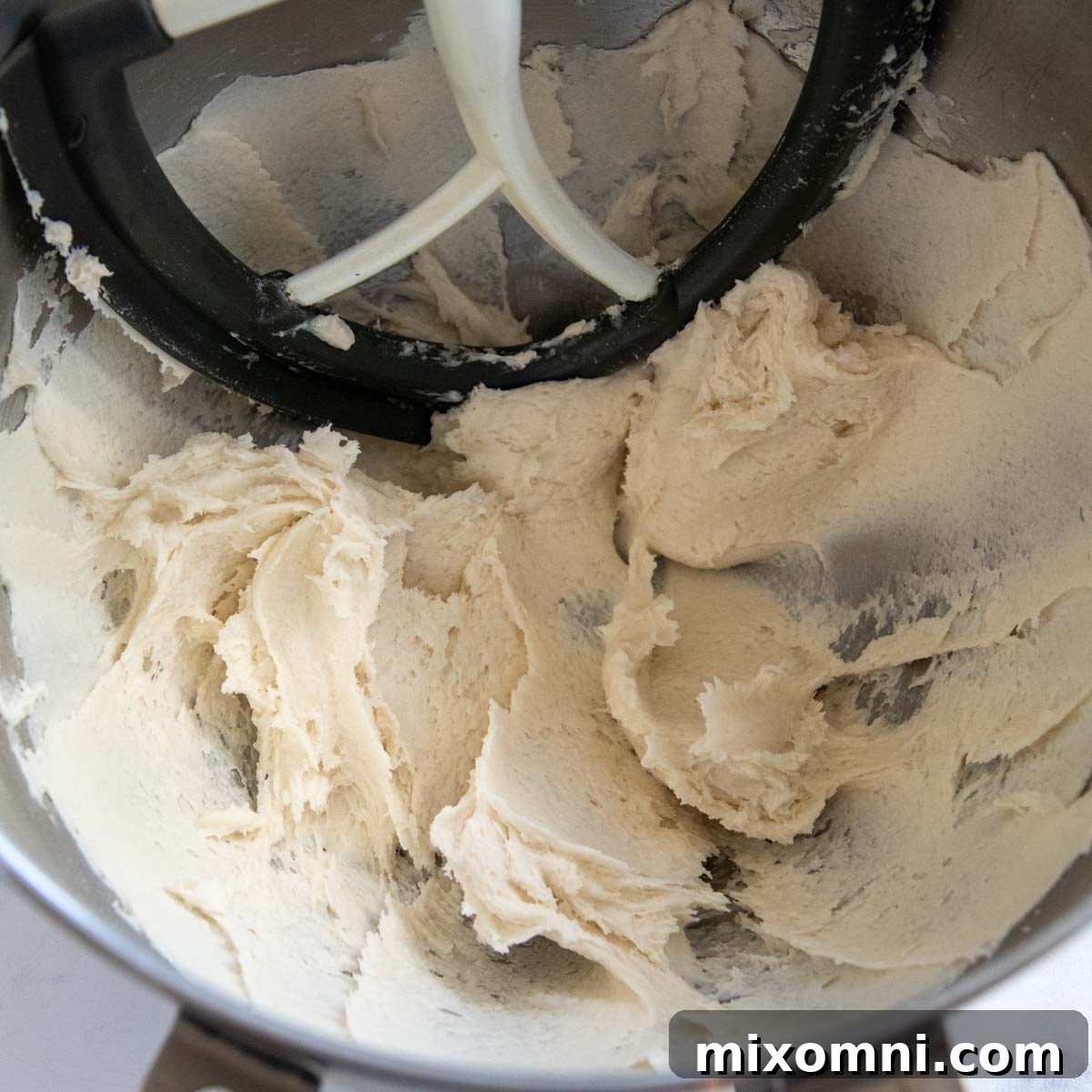 The gluten-free flatbread dough after mixing, showing its stiff and slightly sticky consistency.