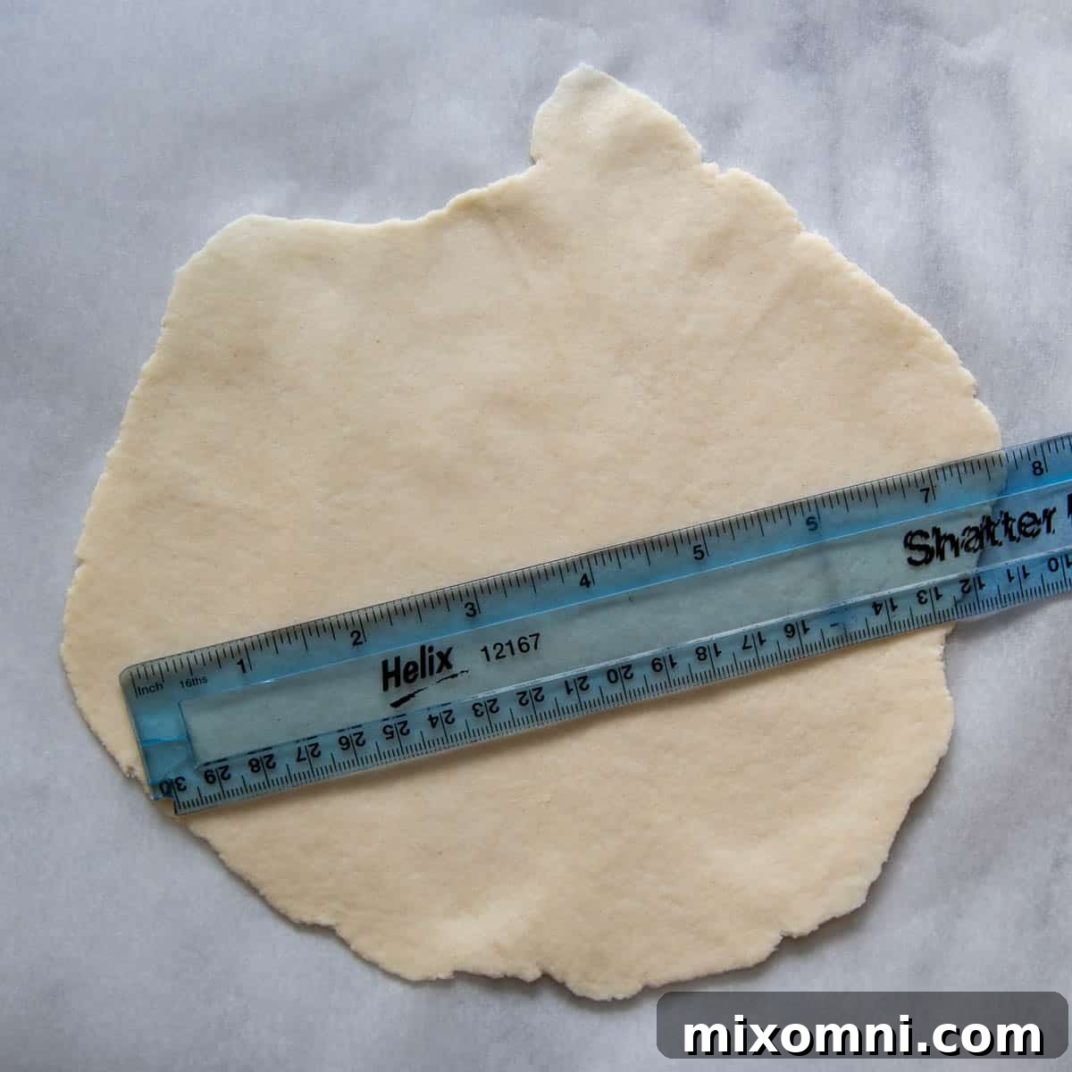A rolled gluten-free tortilla with a ruler on it, demonstrating the ideal 6.5-inch diameter for perfect sizing.