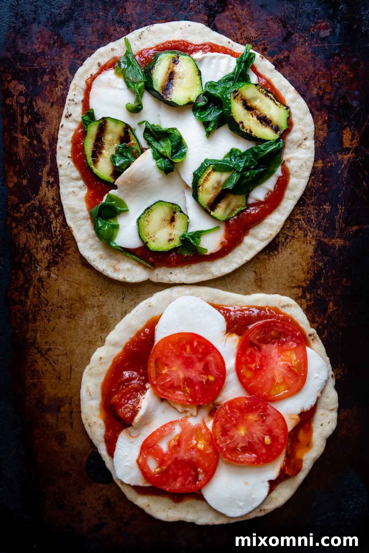 Pizza with toppings added, before its final grill.