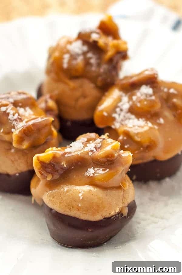 A close up shot of a plate of buckeyes candy with turtle topping, showcasing the caramel and pecans.