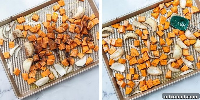 Step 1: Sweet potatoes and onions tossed with olive oil and spices on a baking sheet, ready for roasting.