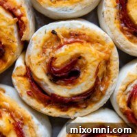 overhead shot of pizza rolls close together.