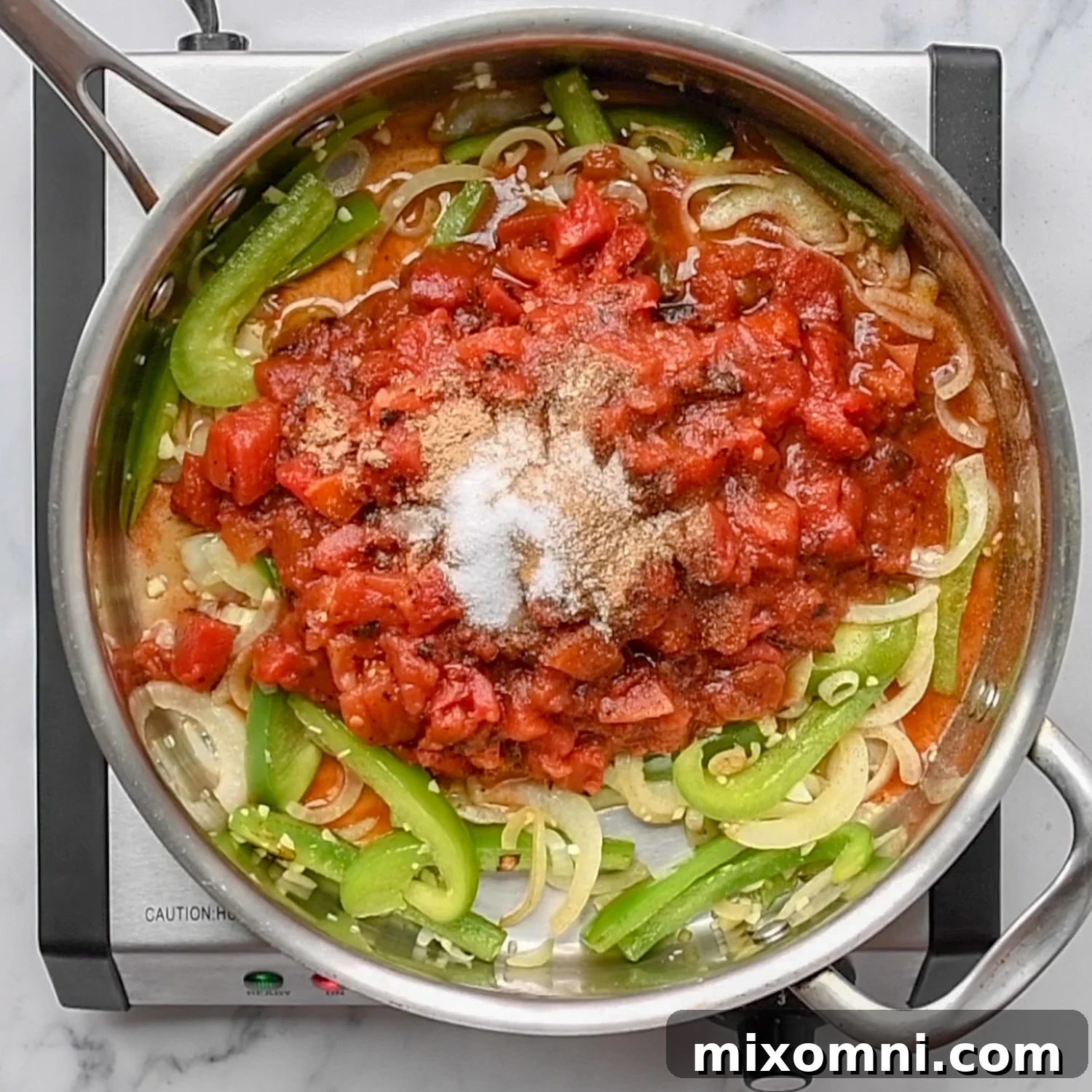 Black beans and corn stirred into the Mexican sauce with vegetables.