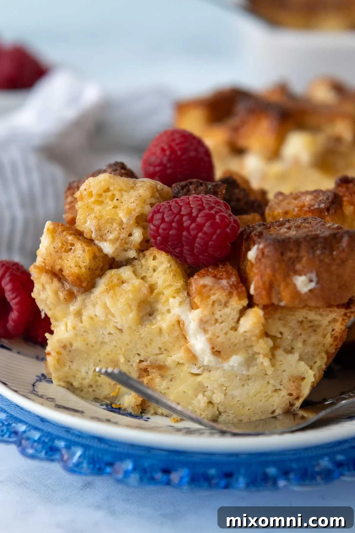 close up of the inside of a slice of gluten-free french toast casserole, showing its moist texture and golden crust.