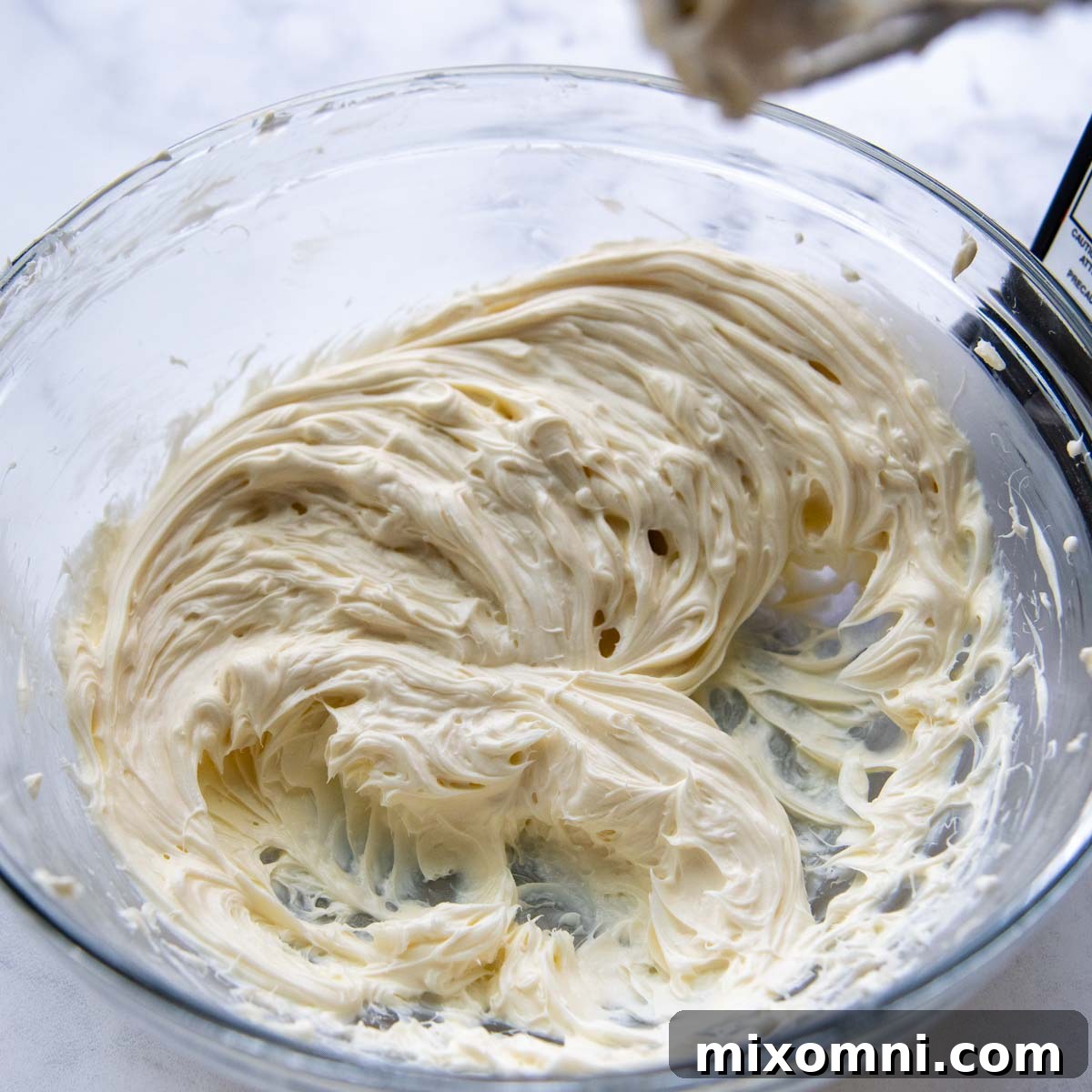 cream cheese mixture in a bowl, showing its smooth texture for the filling.