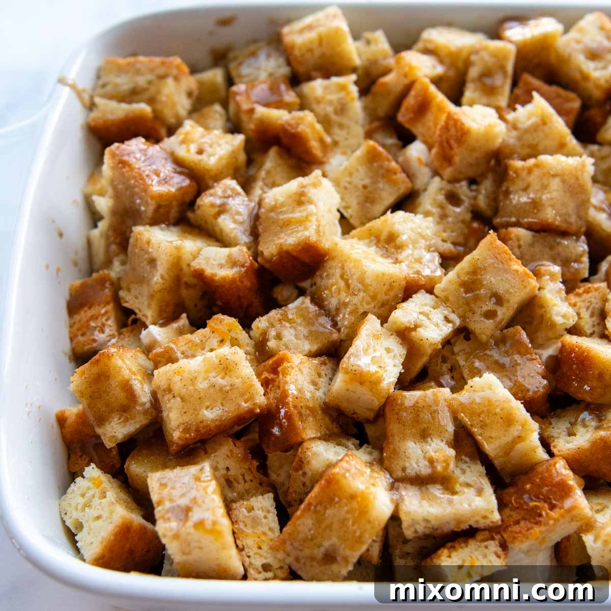 the brown sugar butter topping brushed on top of the casserole before baking, ensuring a golden finish.
