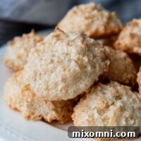 macaroons piled onto a white plate.