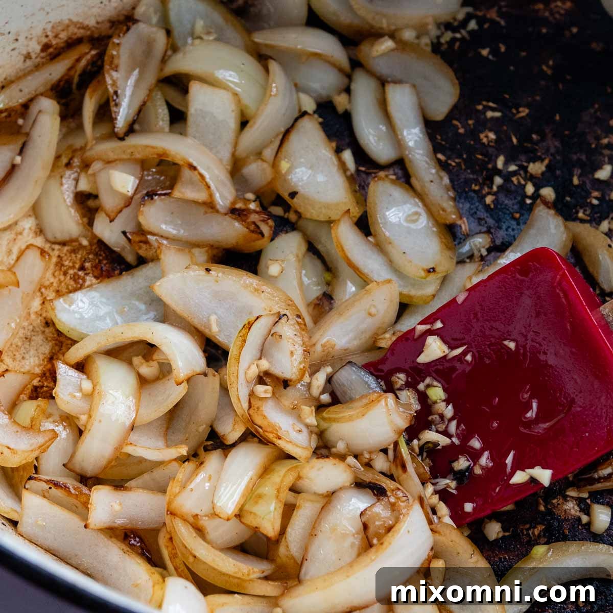 cooked onions in a pot.