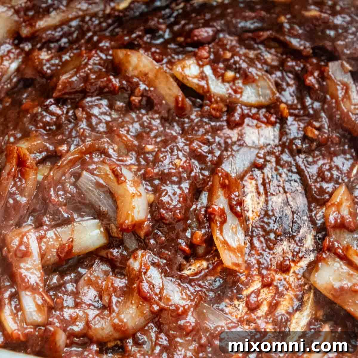 the onions stirred together with tomato paste.