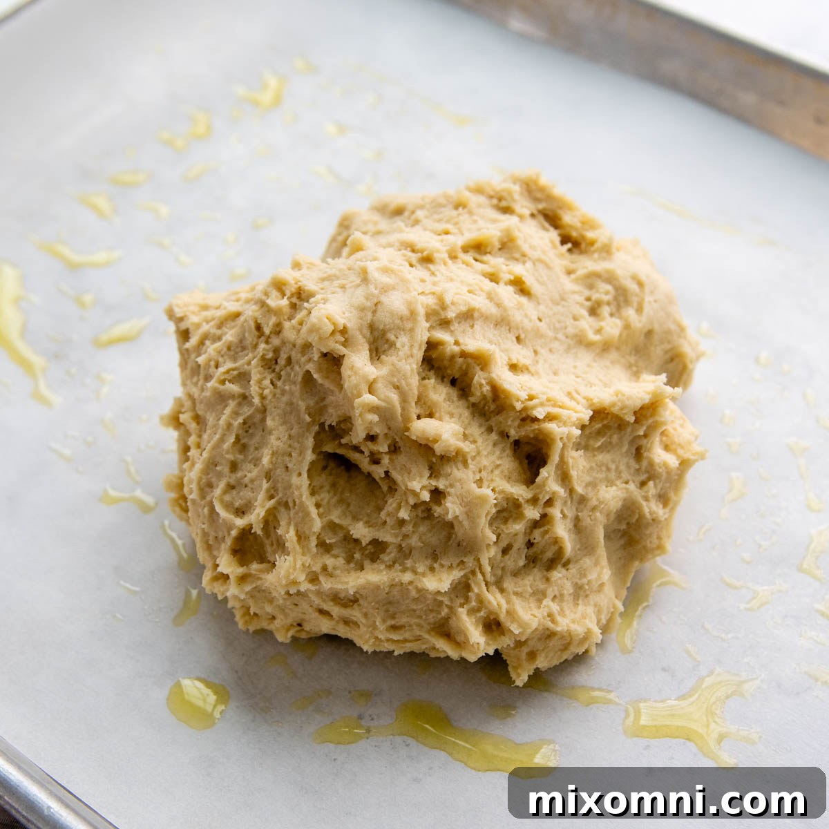 the dough in a loose ball on greased parchment.