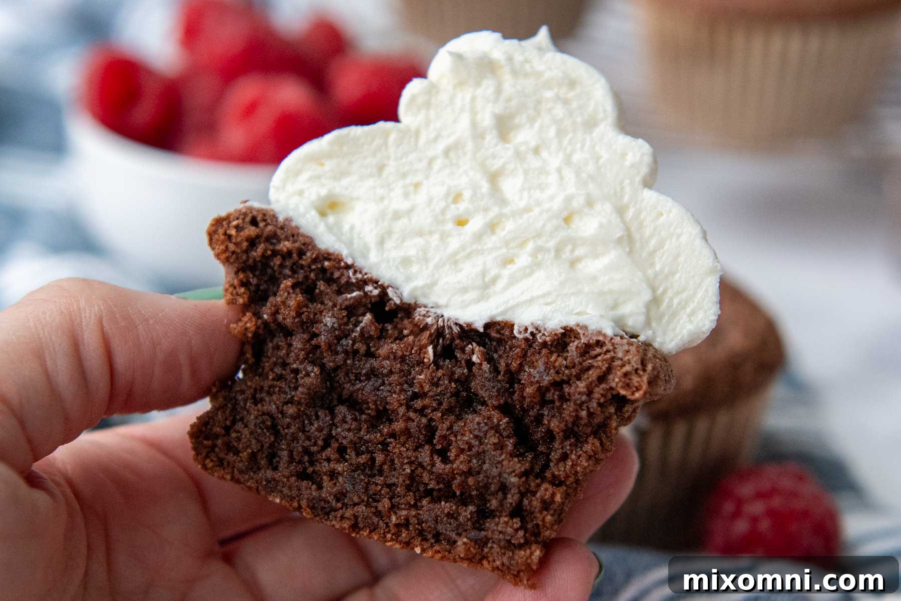 Beautifully frosted chocolate almond flour cupcakes arranged artfully, ready for serving.