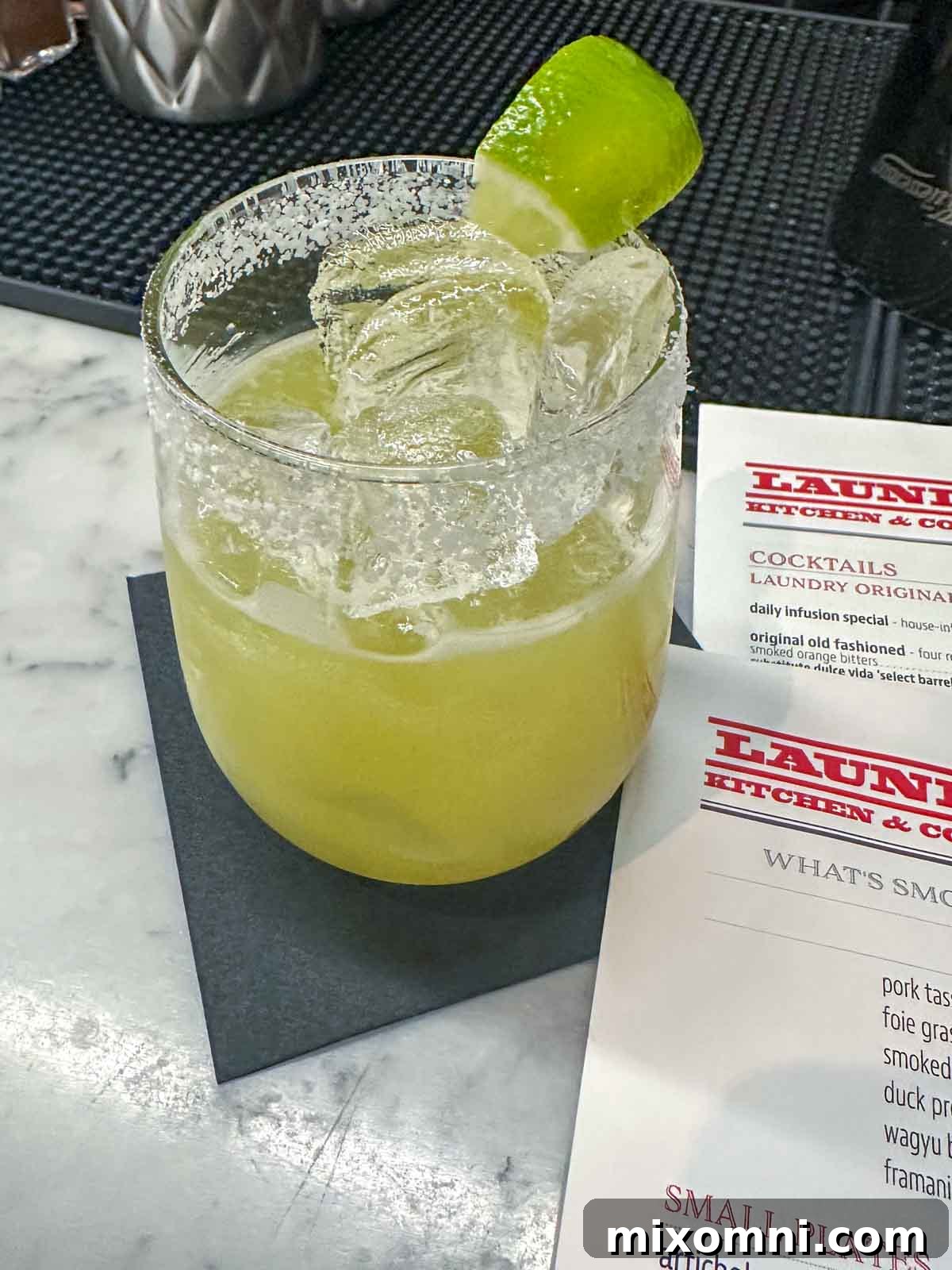 Close-up of a Fiery Margarita cocktail on a menu, showcasing the vibrant drink scene and perfect for happy hour.