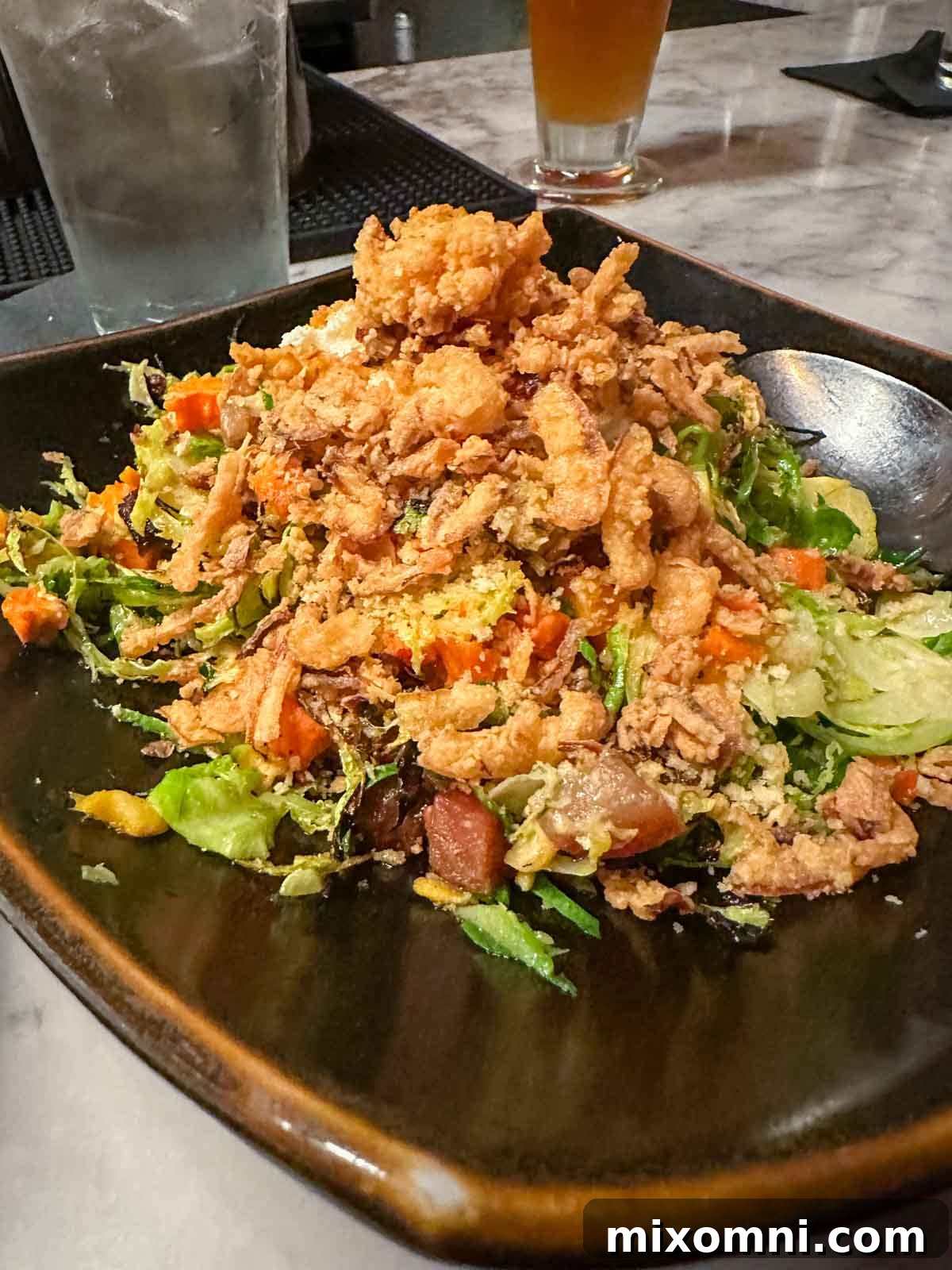 A beautifully presented plate of fried shrimp, showcasing a delicious appetizer, gluten-free and perfectly crispy.