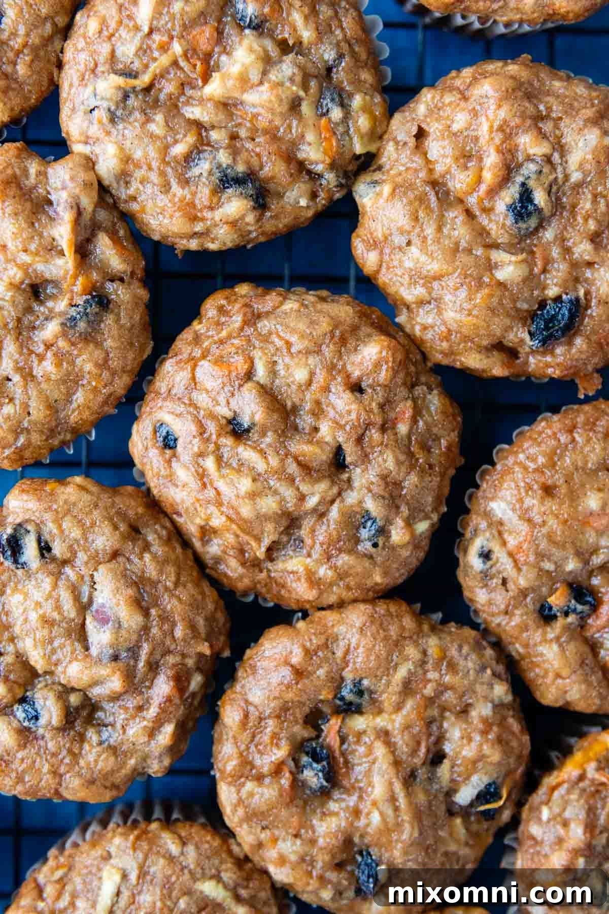 overhead shot of muffin tops close together, showcasing golden-brown tops and rich texture.