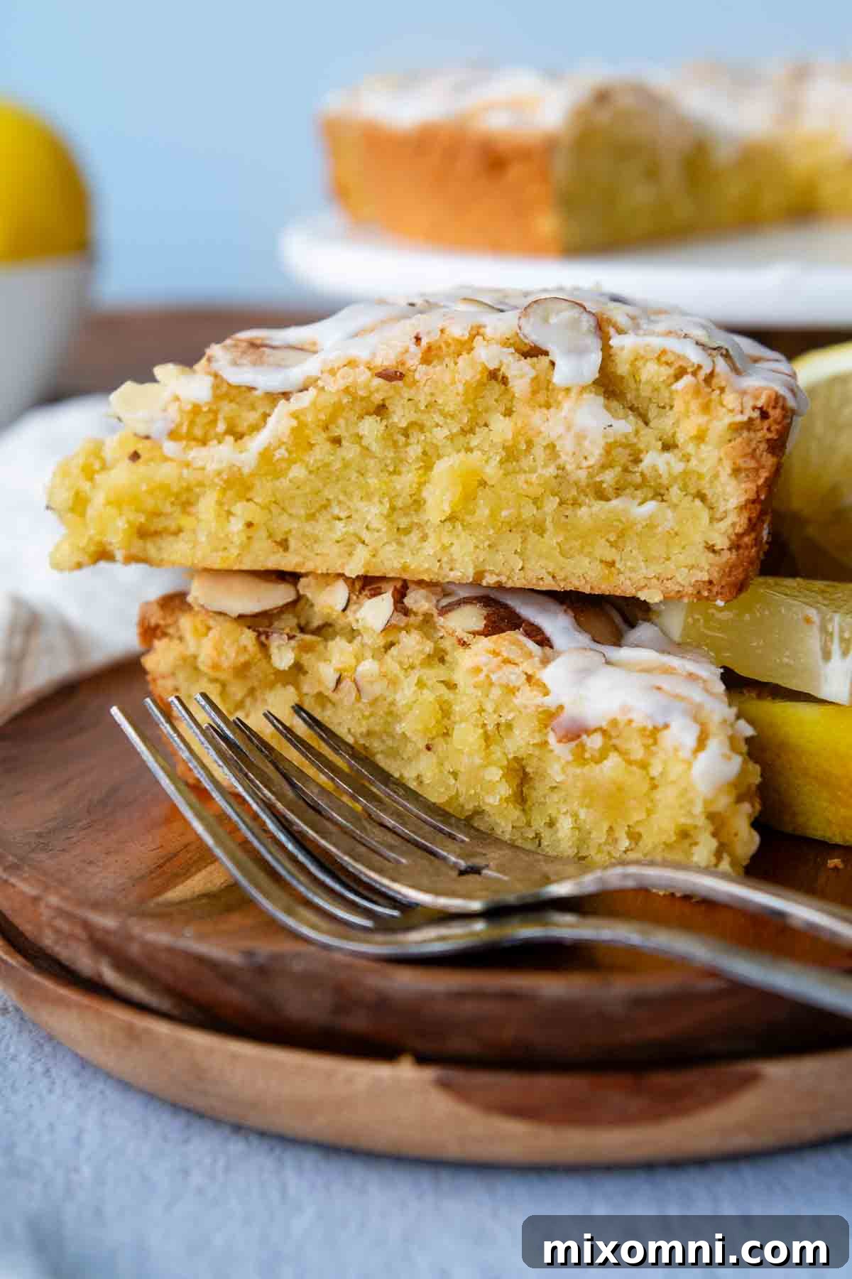 a stack of two slices of lemon almond cake.