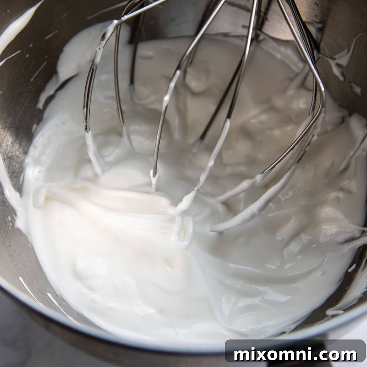 egg whites beaten in a large bowl.