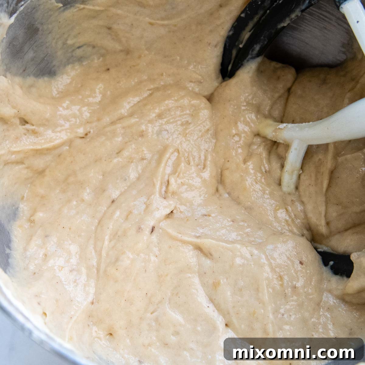 The completed gluten-free banana cake batter, thick and ready for baking in prepared pans.