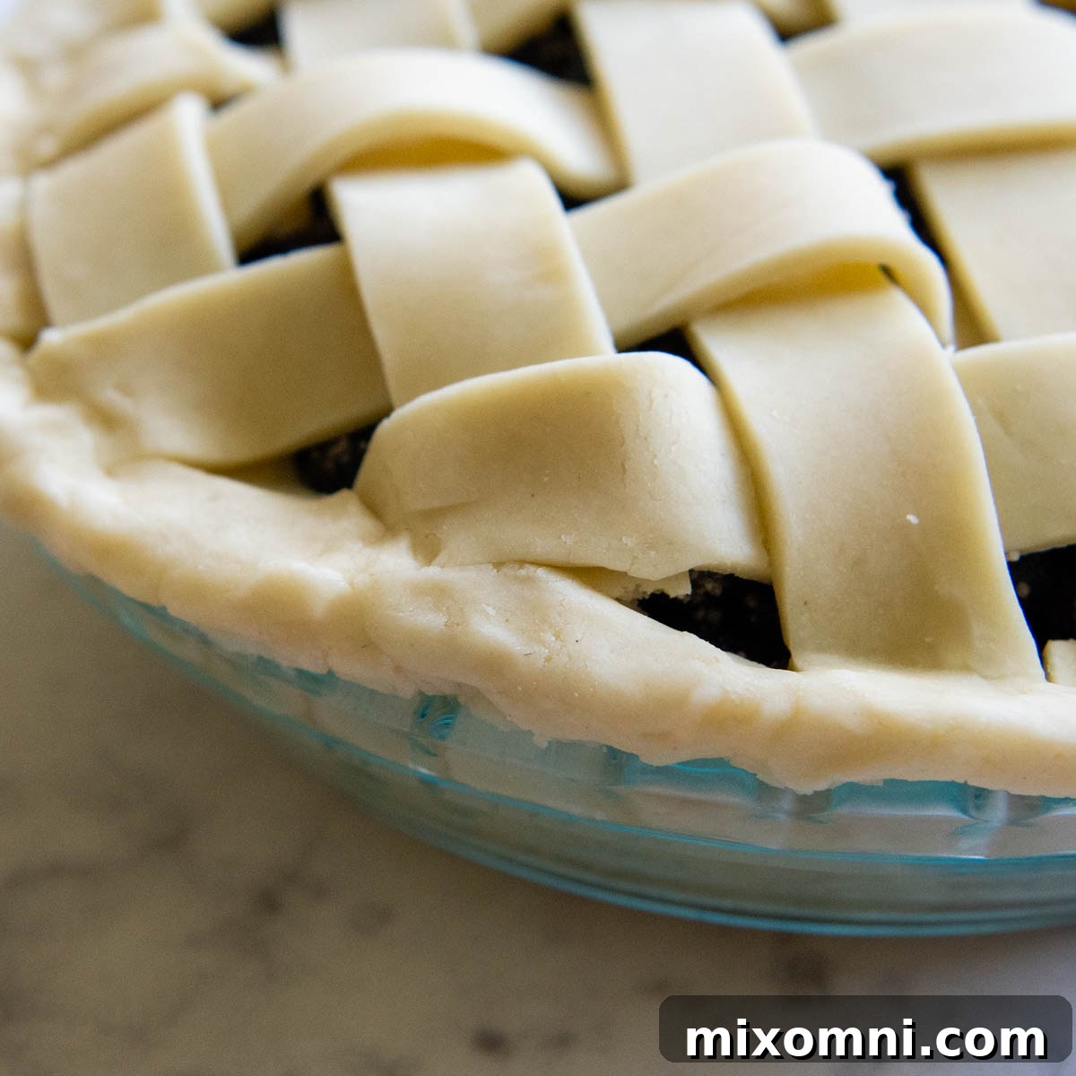 A close-up view of the side crust before it's been fluted, showing the clean edge.