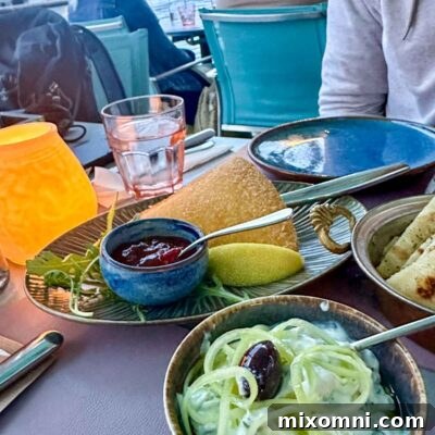 A delicious gluten-free dinner at Ammos, featuring a vibrant Mediterranean dish with fresh ingredients, showcasing safe dining options for celiacs.