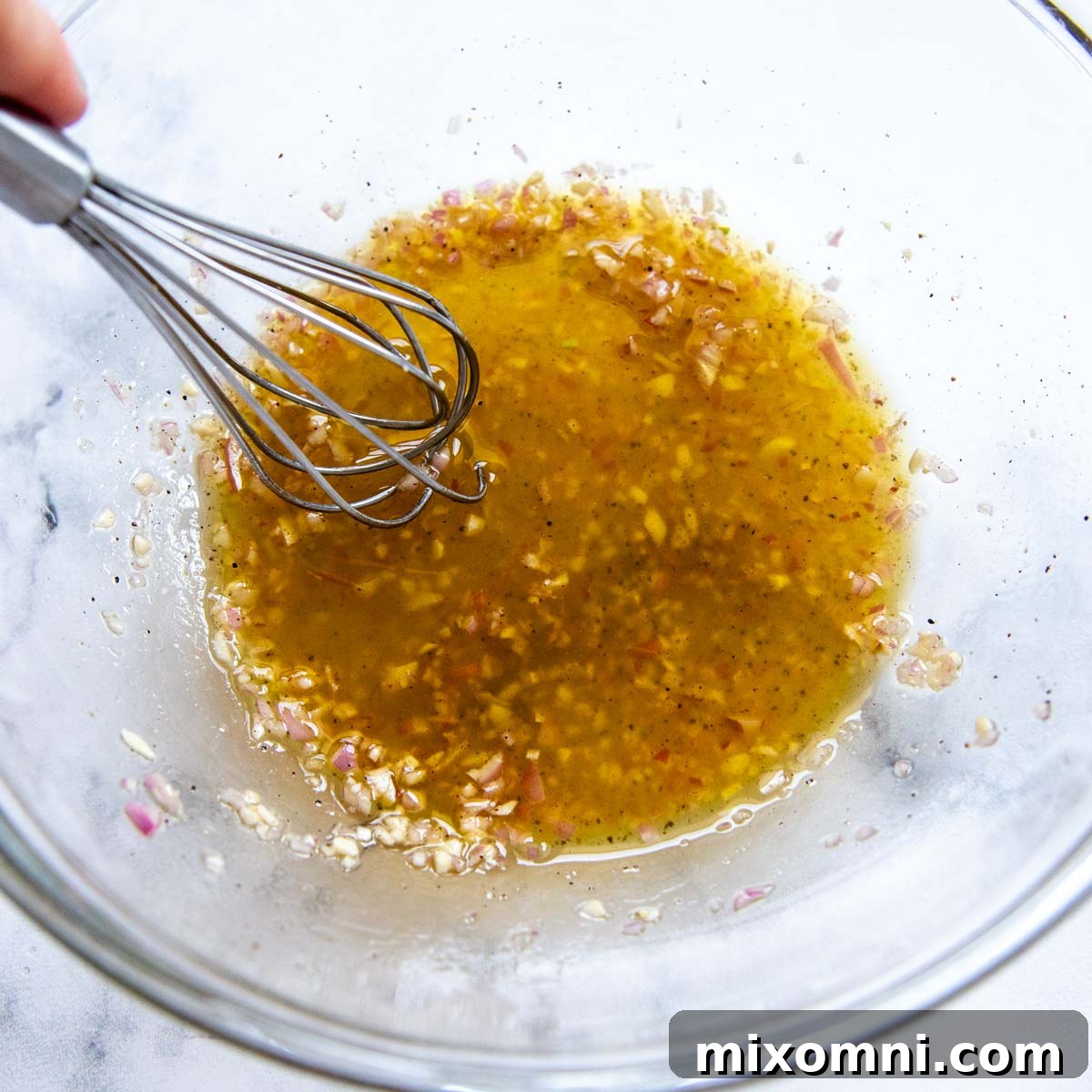 ingredients whisked together for the tomato's dressing.