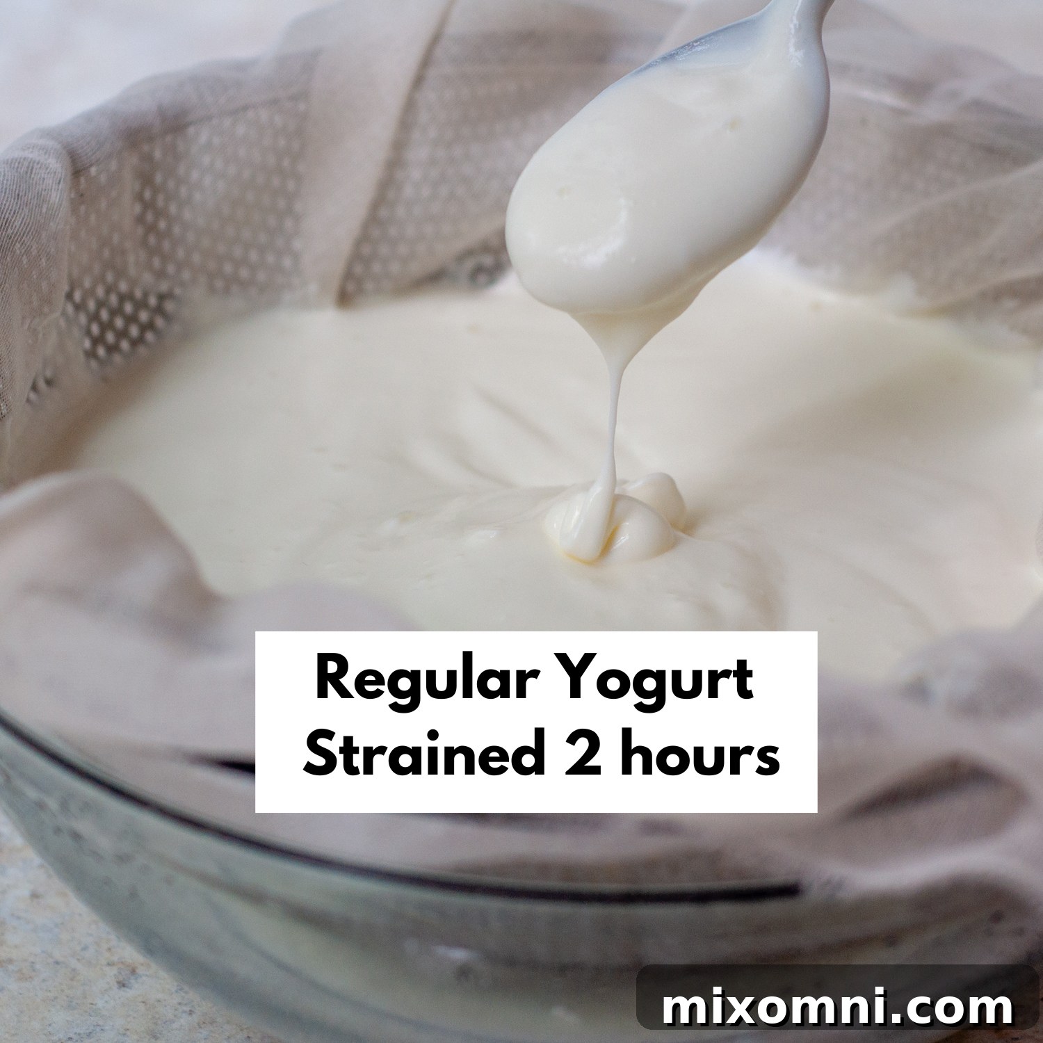 A bowl of yogurt after straining for 2 hours, showing a moderately thick consistency.