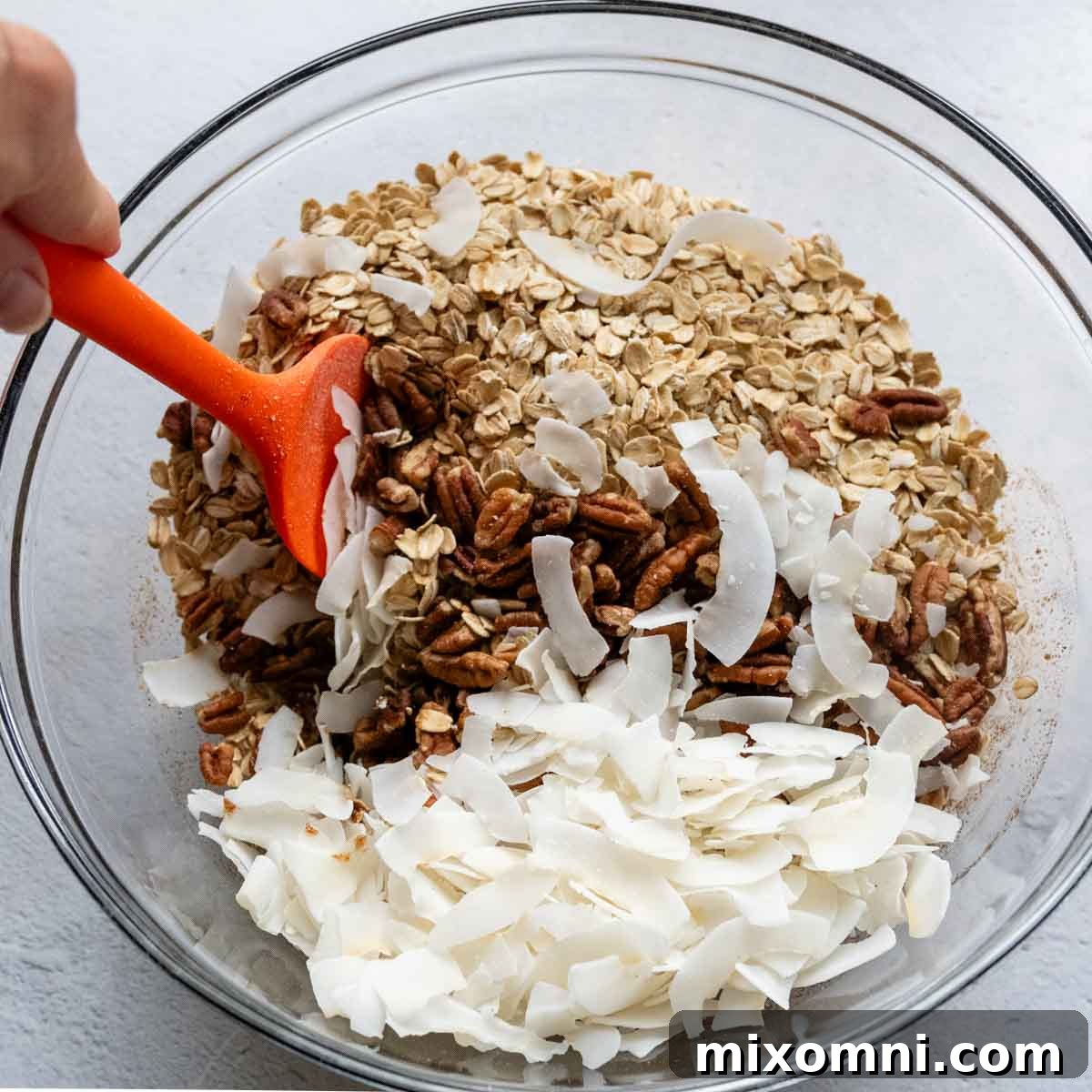 dry ingredients being mixed into the wet ingredients.