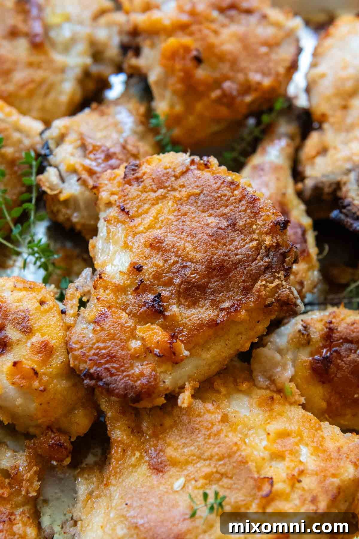 close up of gluten-free fried chicken on a baking sheet.
