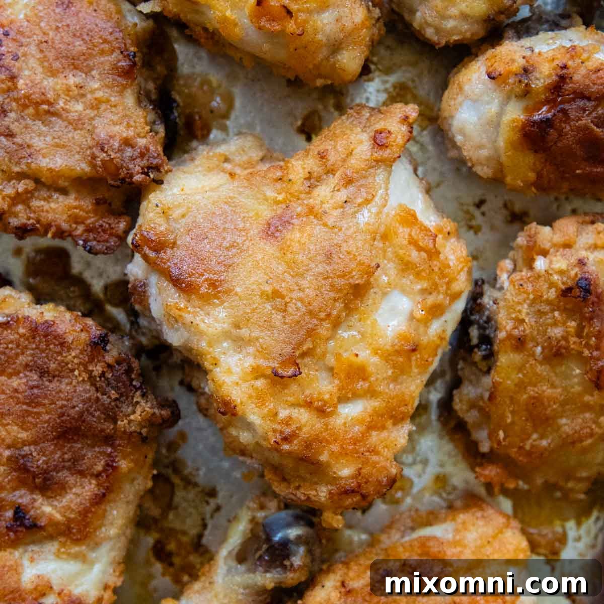 overhead shot of fried chicken with pieces around it.
