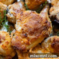 close up of gluten-free fried chicken on a baking sheet.
