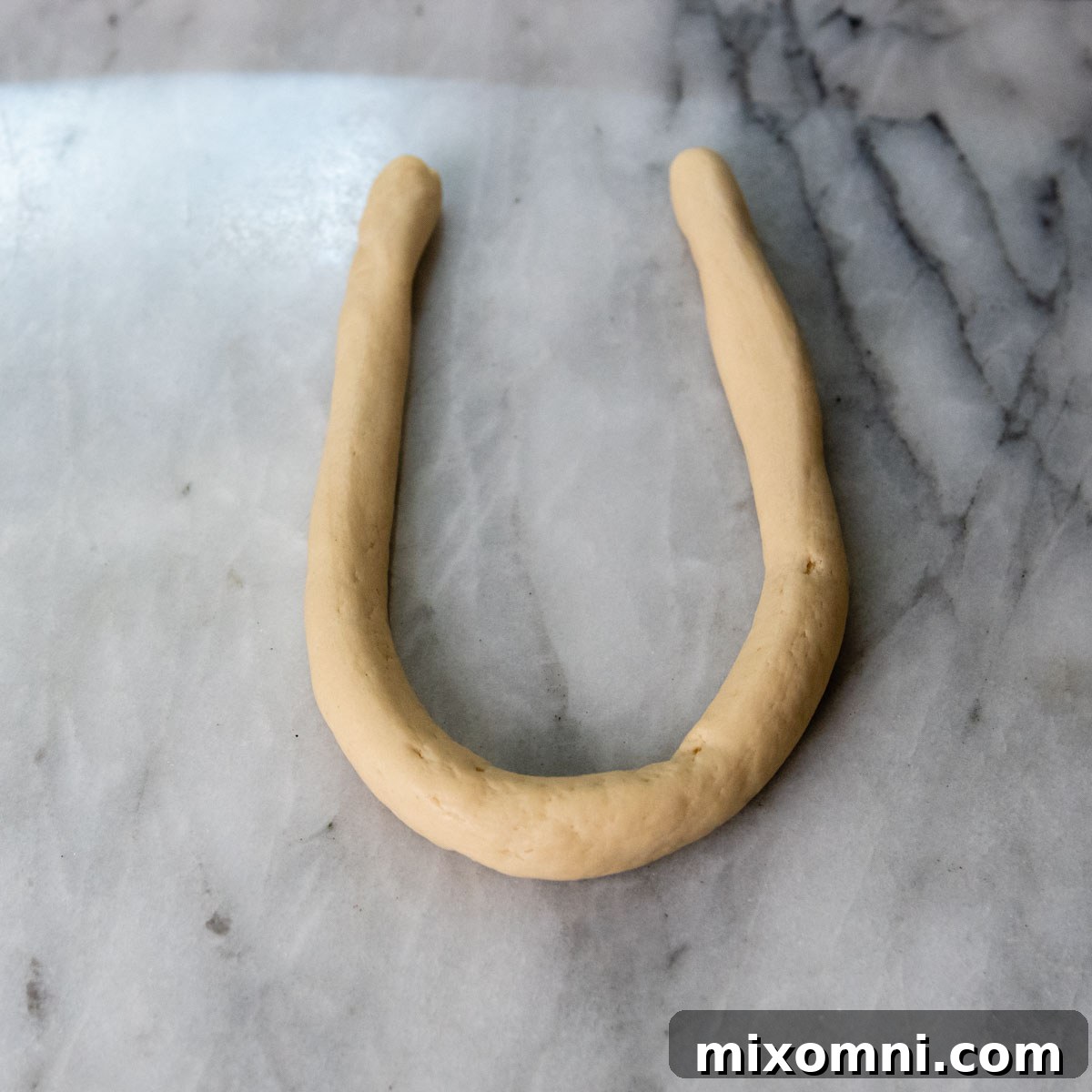 dough shaped into a horseshoe.