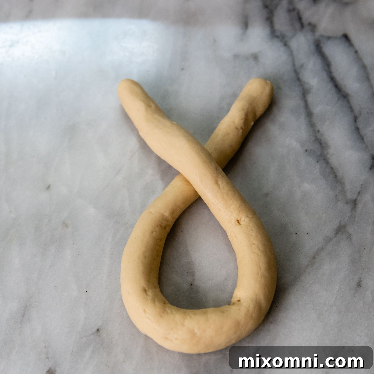 dough with the ends crossed over one another.