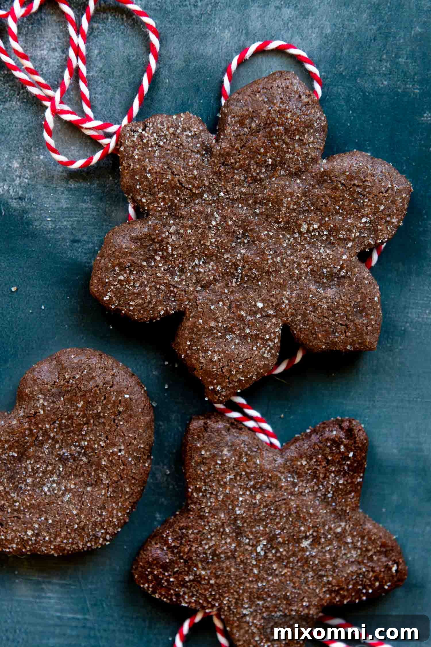 Close up overhead image of Basler Brunsli cookies, showcasing their intricate shapes and sugared tops.