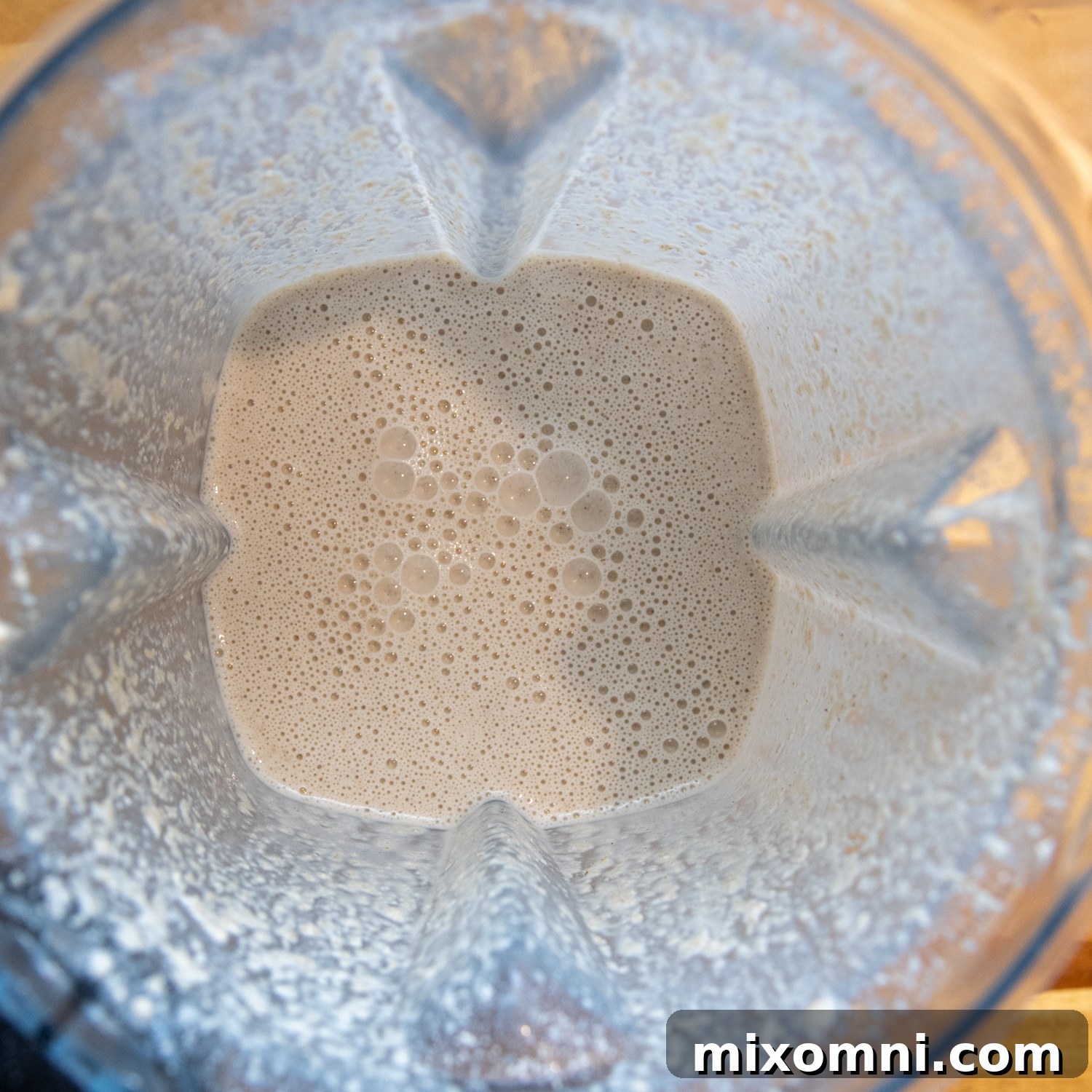 All wet and dry tortilla ingredients combined in a blender, ready for mixing into a smooth batter.