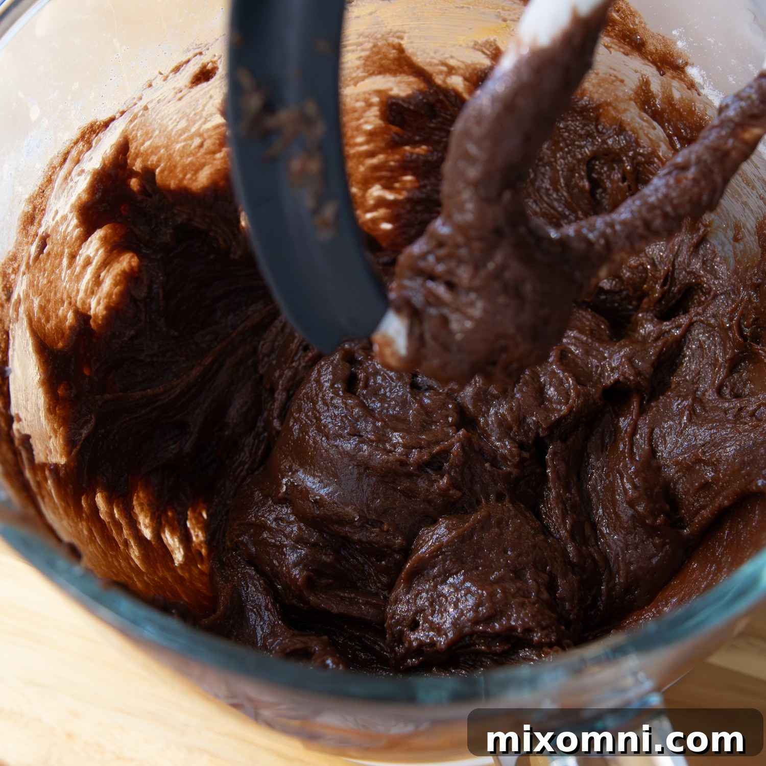 Ingredients being mixed together in a blender for the cake batter, showing the initial thick stage.