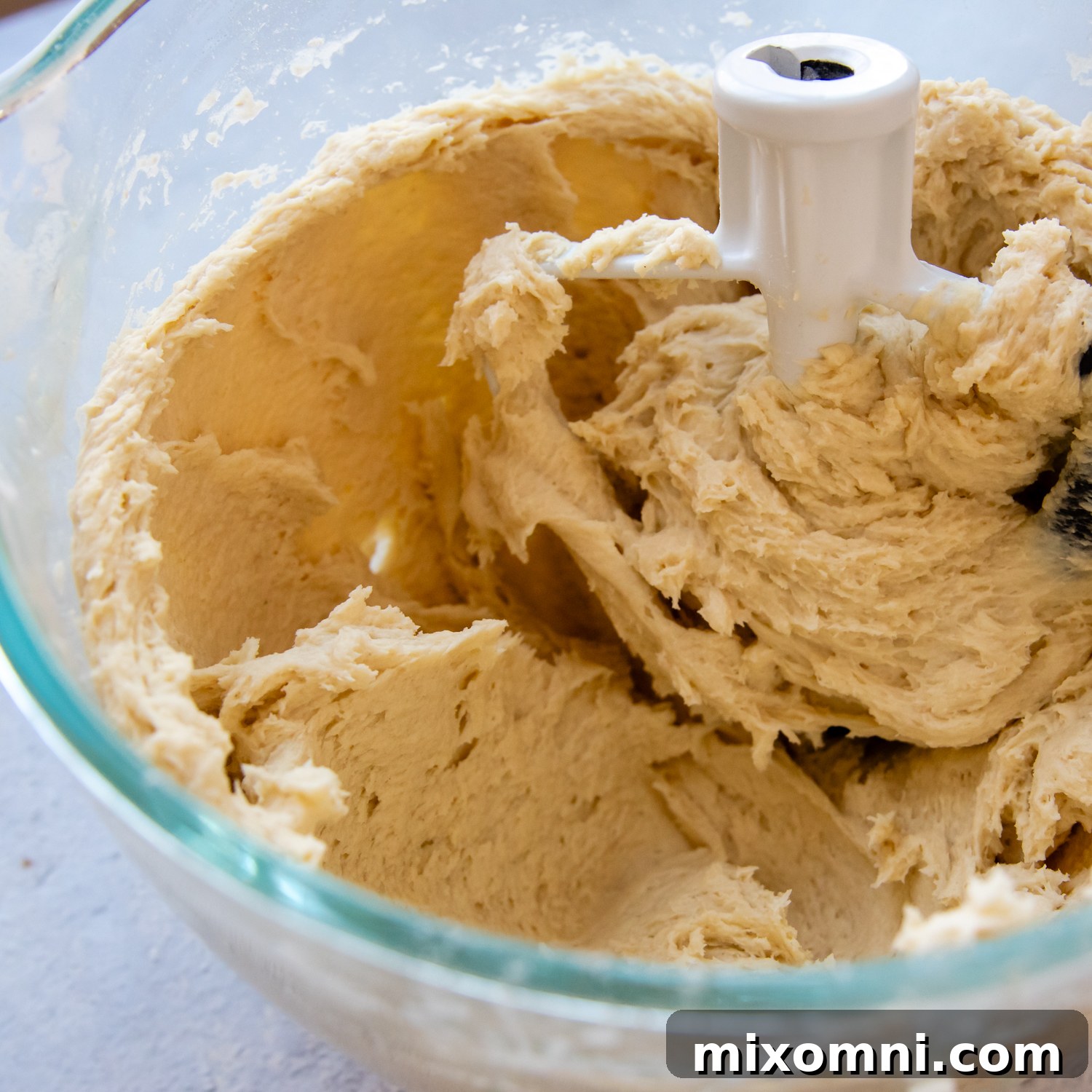 Gluten-free English muffin ingredients being mixed in a stand mixer.