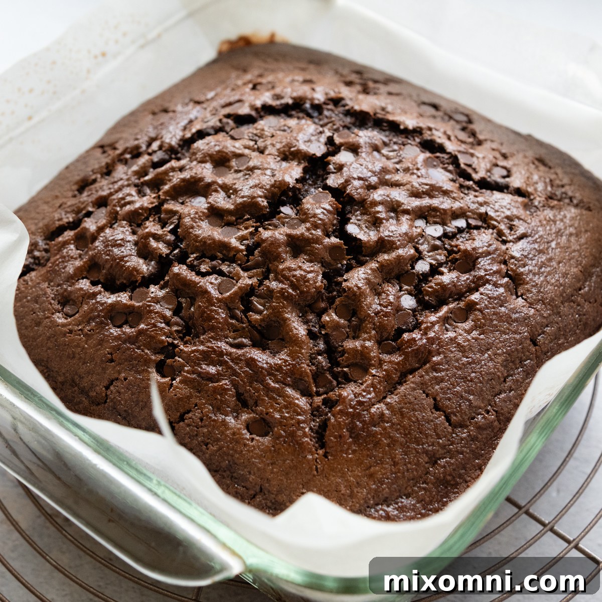 A freshly baked oat flour chocolate cake in the baking pan, cooling before frosting.