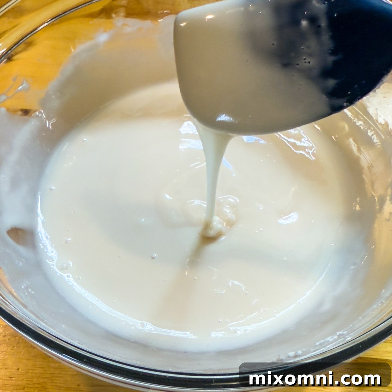 Glaze dripping from a spoon.