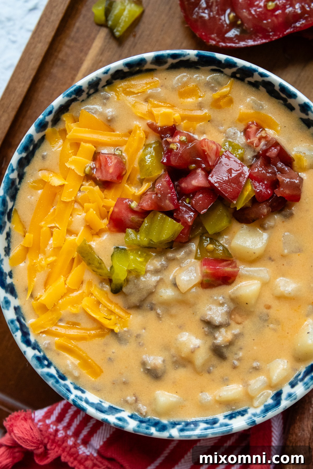 Overhead shot of soup topped with toppings in a bowl.