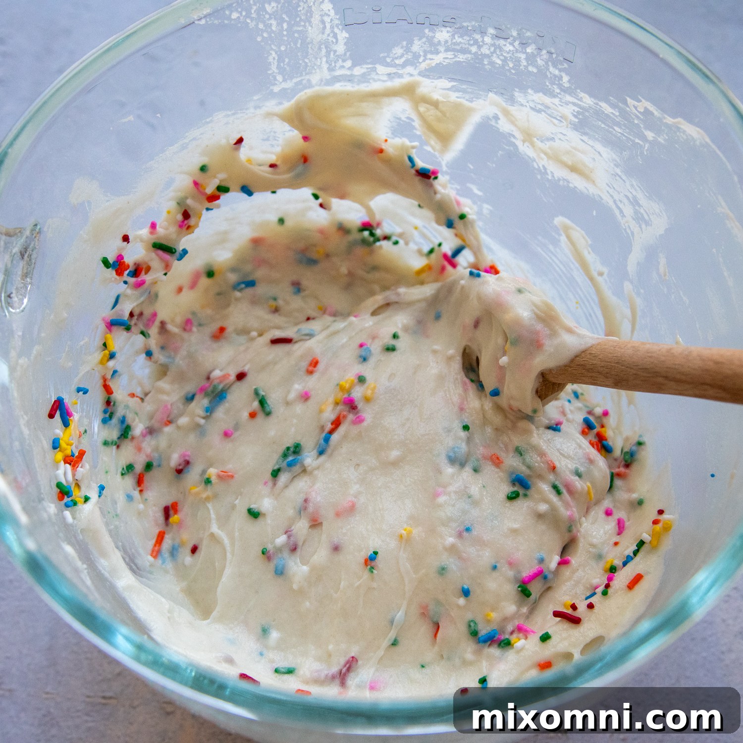 Ingredients with sprinkles added in a glass bowl.