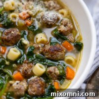 Gluten Free Italian Wedding Soup in a white bowl.