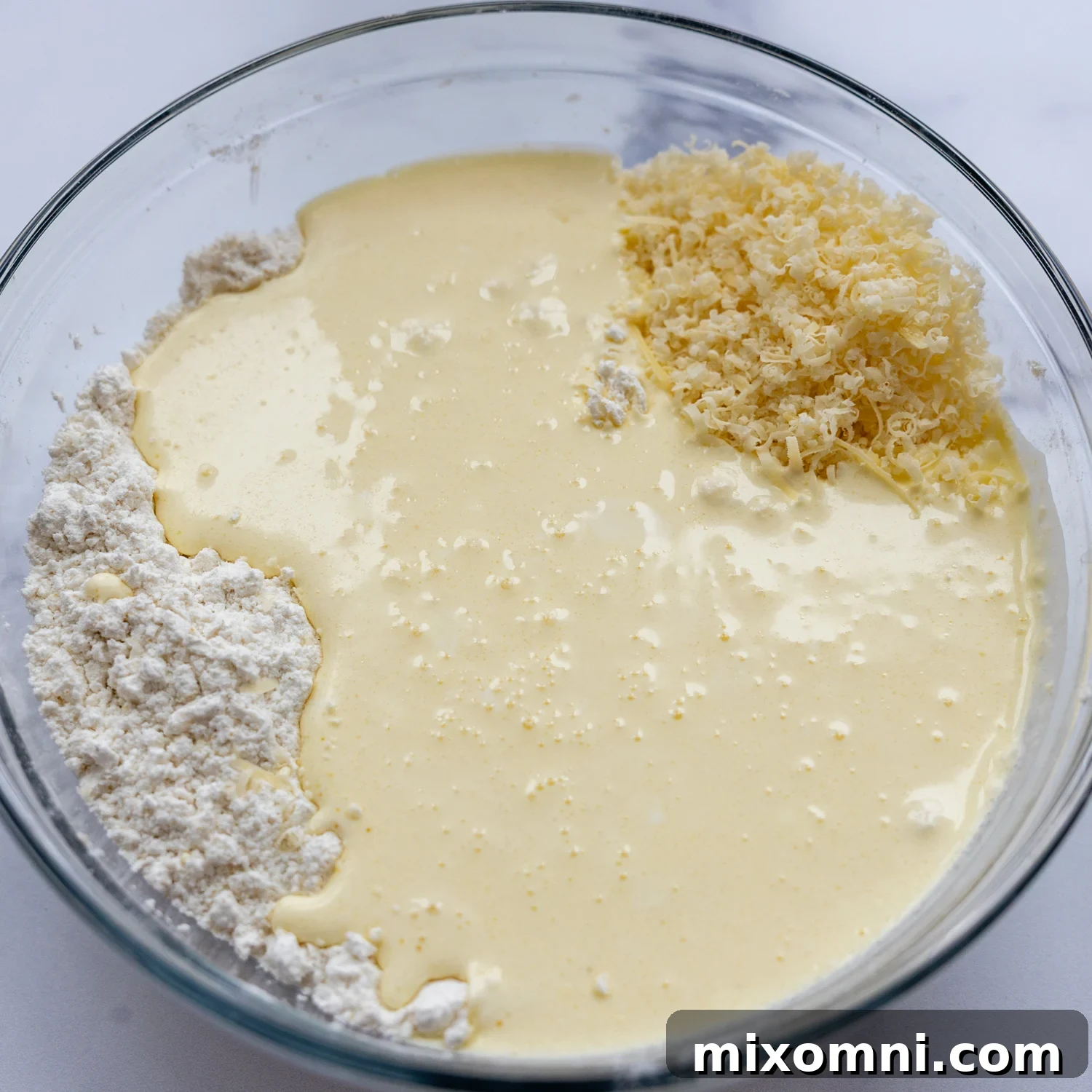Biscuit ingredients in a glass bowl.