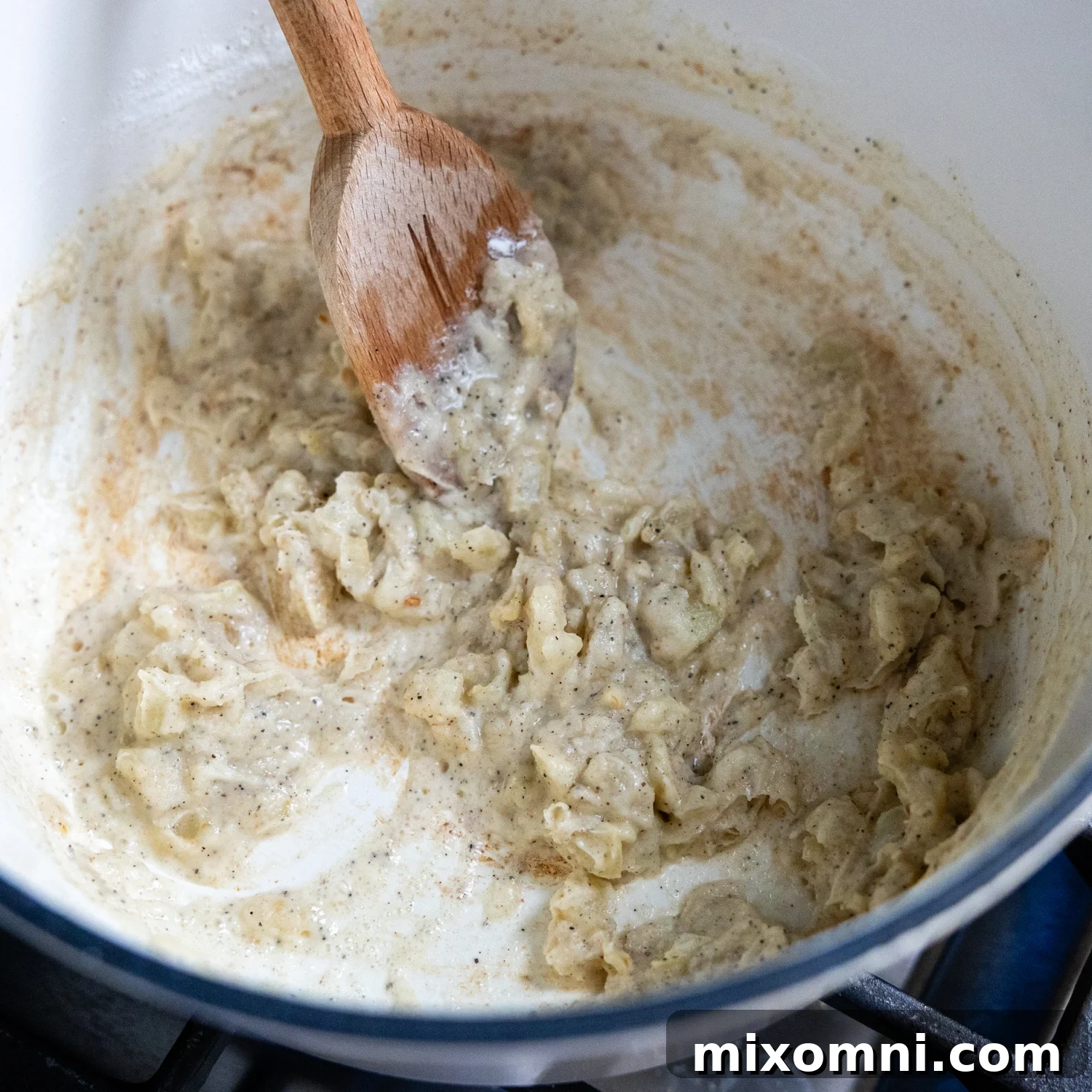Flour and butter ingredients combined in pan.