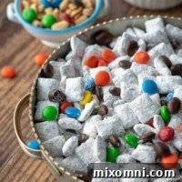 A close-up shot of Nutella puppy chow in a bowl, showing its powdered sugar coating.
